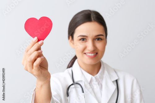 Cardiologist with red heart...