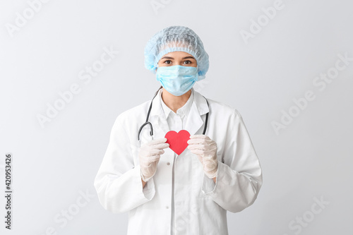 Cardiologist with red heart...