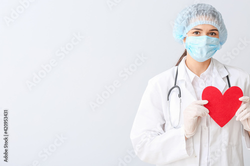 Cardiologist with red heart...