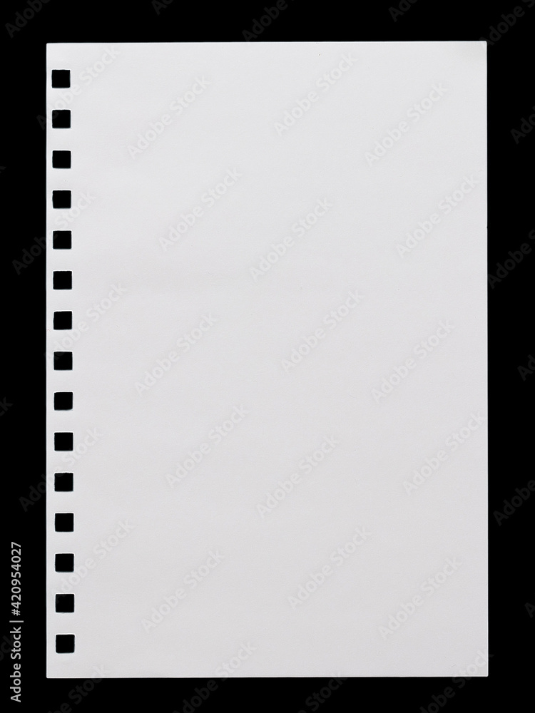 a sheet of white paper with a perforation from a notebook, isolated on a black background a sheet of white paper with a perforation from a notebook, isolated on a black background