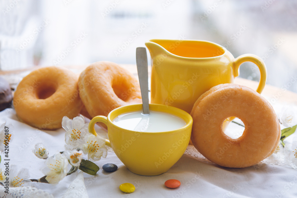 breakfast or snack with donuts and cup of milk breakfast or snack with donuts and cup of milk