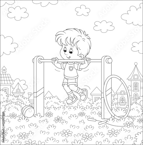 Cheerful little boy in ligh...