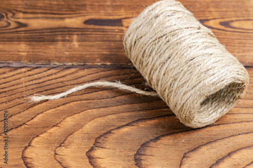 a roll of rope on a wooden table