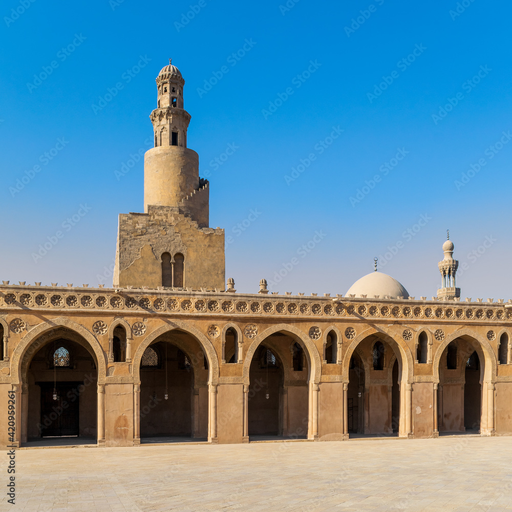 View from courtyard of Ibn Tulun Mosque with it's unique design helical outer staircase minaret, and dome and minaret of Amir Sarghatmish mosque in the far end, Sayyida Zaynab, Medieval Cairo, Egypt