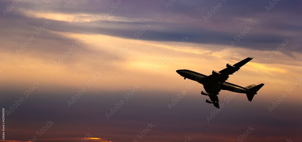 Airplane take off on a sunset.