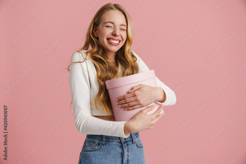 Beautiful happy young blonde woman isolated over pink Beautiful happy young blonde woman isolated over pink