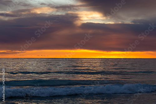 View of a sunset over a sea. © Sergey Fedoskin