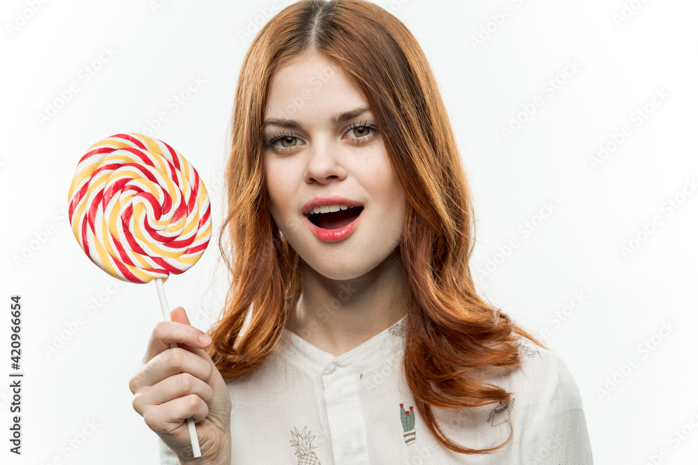 woman in white shirt multicolored lollipop in hands charm delight dessert
