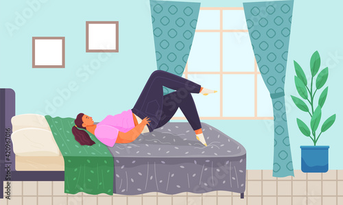 Thick girl puts on skinny jeans lies on bed, young fat woman relaxing in mattress in bedroom