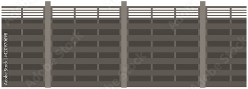 High concrete or metal fence with lattice. Element of landscape and interior of outdoor territory