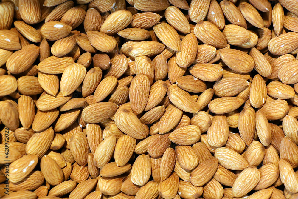 Almonds Background. Full Frame Shot Of Almonds For Sale In Market Almonds Background. Full Frame Shot Of Almonds For Sale In Market