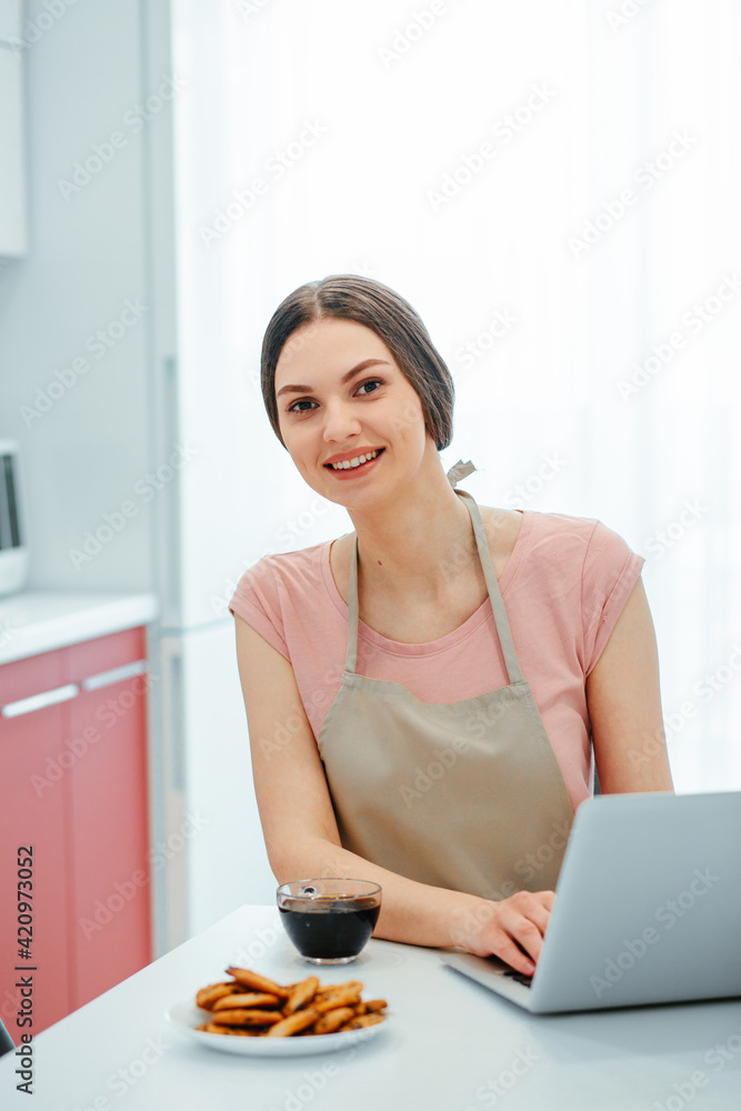 Woman feeling happy while working from home with modern gadget Woman feeling happy while working from home with modern gadget