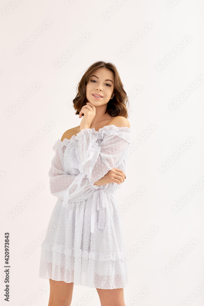 beautiful young brunette woman in white dress beautiful young brunette woman in white dress