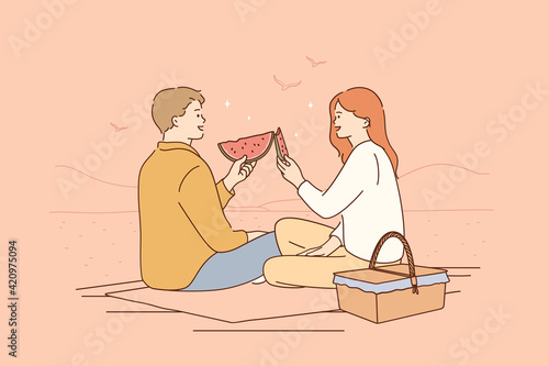 Romantic dating, picnic, summertime concept. Young happy couple cartoon characters sitting on floor having picnic talking smiling eating ripe fresh watermelon together vector illustration 