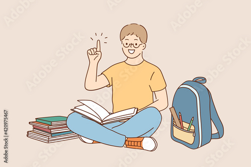 Back to school, education, learning concept. Little happy boy in glasses doing homework at home with backpack full of books and pencils vector illustration 