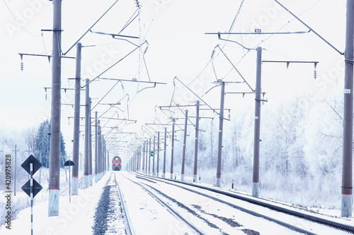 winter railway landscape, view of the rails and wires of the railway, winter delivery way