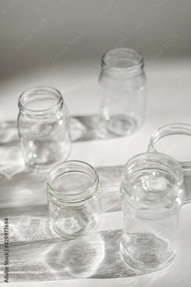 empty jars with shadow on white empty jars with shadow on white