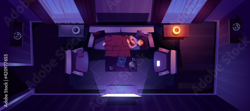 Young man sleeping on sofa top view, night relax