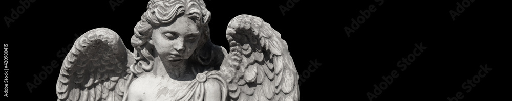 Ancient statue isolated on black background. Sad angel as symbol of death and end of human life.