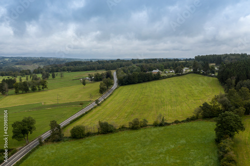 Aerial view of a road crossing farmlands, in G'doumont (Malmedy), Belgium photo