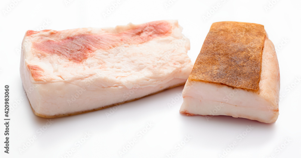raw lard two pieces on white background, pork fat
