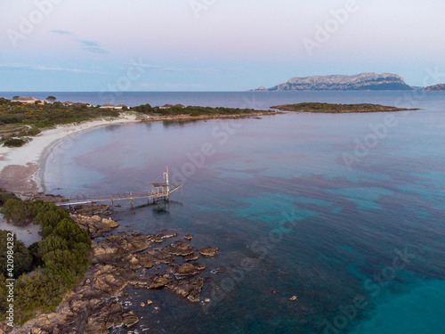 Spiaggia di Nodu Pianu, nei pressi di Olbia, Sardegna. Vista aerea al tramonto. photo