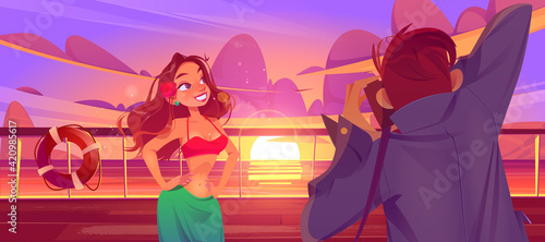 Woman and photographer on cruise liner deck sunset