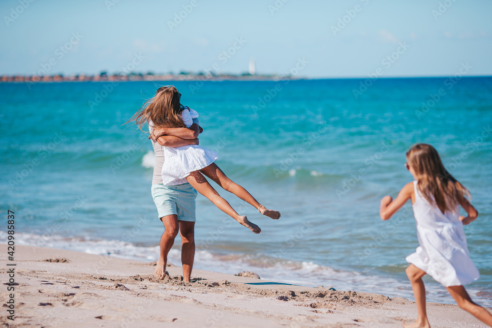 Portrait of family in summer on the seashore