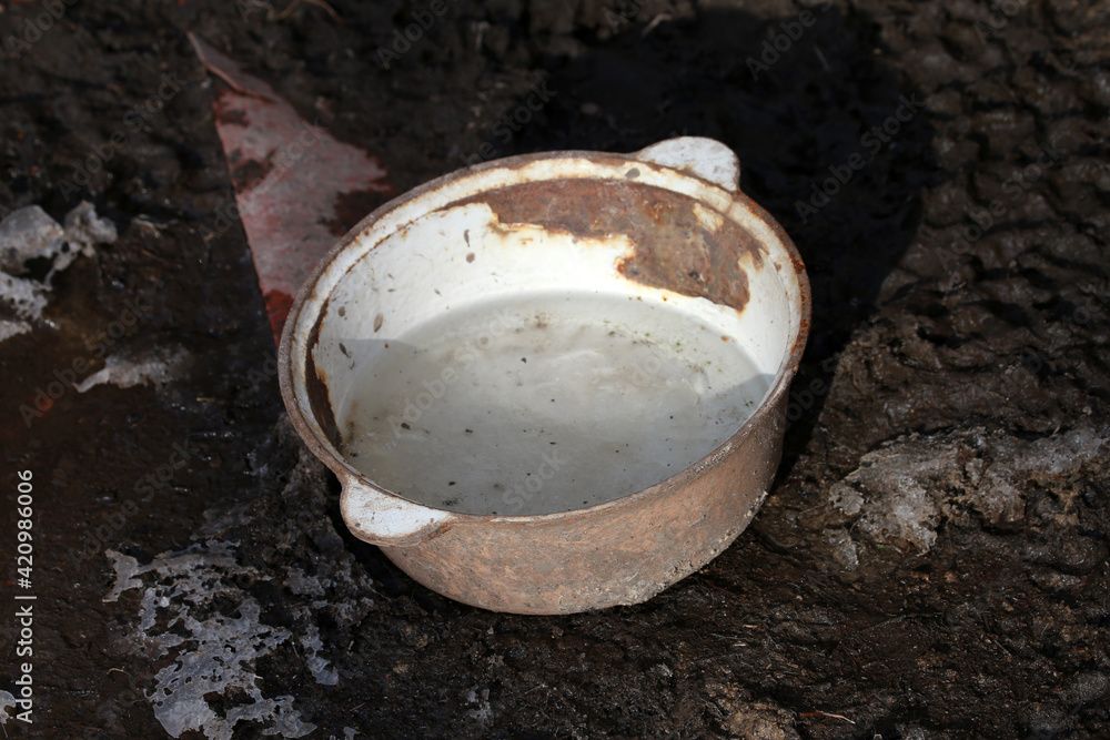 old rusty animal water bowl old rusty animal water bowl