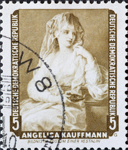 GERMANY, DDR - CIRCA 1959 : a postage stamp from Germany, GDR showing a self-portrait of the artist Angelika Kauffmann in the costume of a vestal virgin. Paintings from the Dresden  painting gallery photo