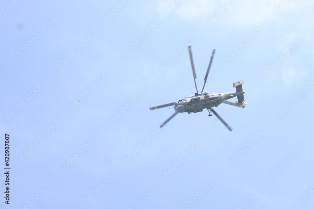 military rocket helicopter over the sea. military rocket helicopter over the sea.