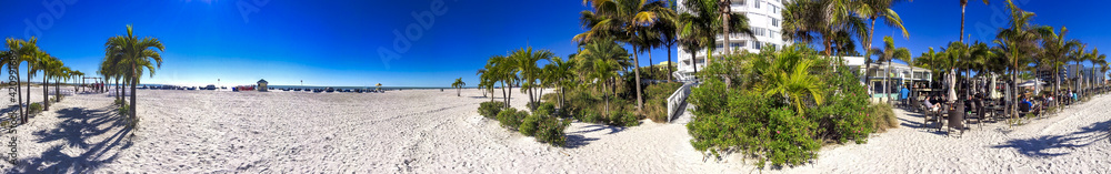 ST PETERSBURG, FL - FEBRUARY 2016: Tourists along St Pete Beach on a beautiful winter day - Panoramic view