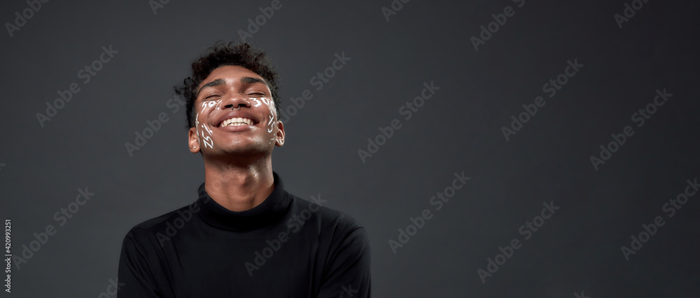 African american man with percents inscription on face