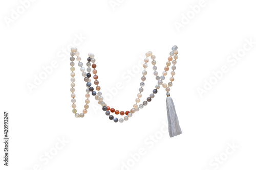 Handmade sacred mala beads isolated on a pure white background. Rudraksha mala seed that increase clarity and general awareness. 
