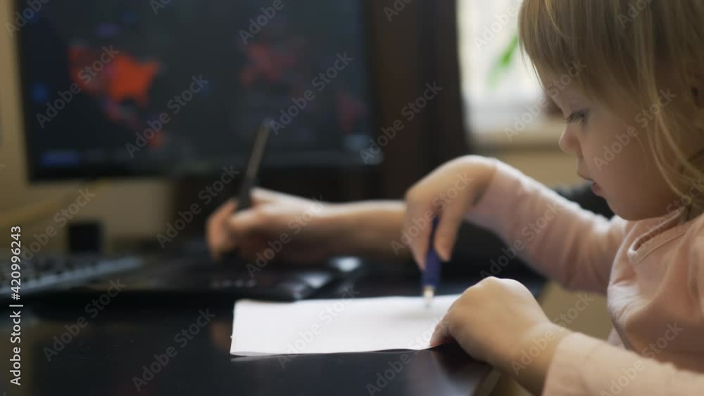 Online working through quarantine with a child, mommy and baby are drawing Online working through quarantine with a child, mommy and baby are drawing