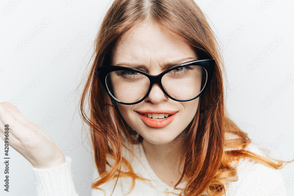 Fototapeta premium red-haired woman emotions fashionable glasses studio face close up