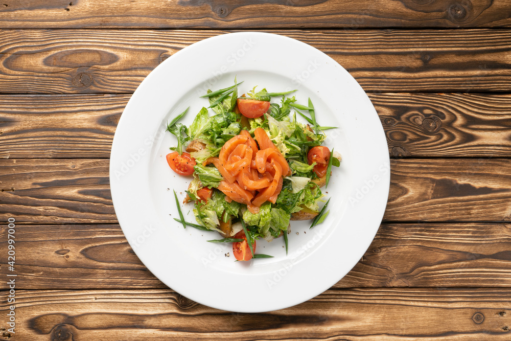 Vegetarian vegetable salad with salmon, potatoes and cherry tomatoes Vegetarian vegetable salad with salmon, potatoes and cherry tomatoes