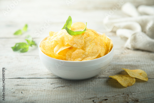 Potato chips in a white bowl