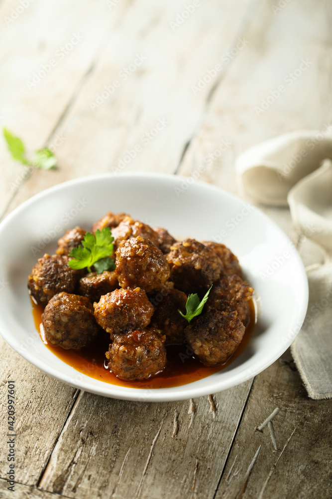 Traditional homemade meatballs with fresh basil Traditional homemade meatballs with fresh basil