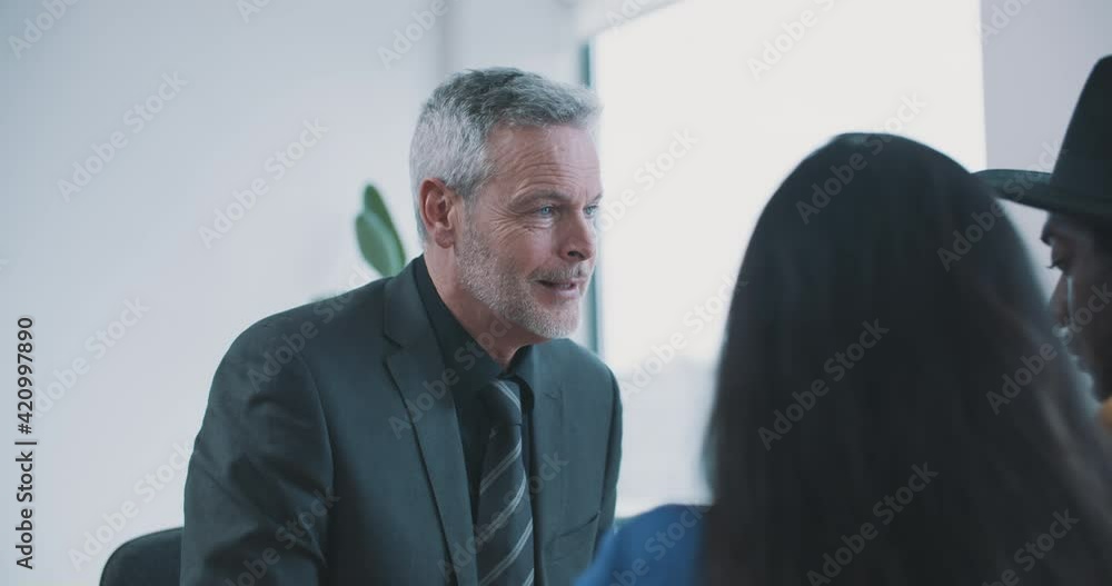 Caucasian businessman discussing document with couple Caucasian businessman discussing document with couple