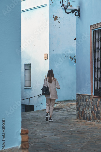 A woman walking in the Smurf Village