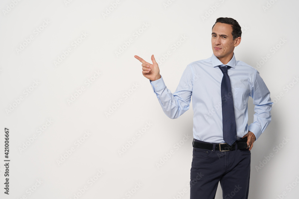 A man in a classic suit shows a finger to the side of the business work office free place A man in a classic suit shows a finger to the side of the business work office free place