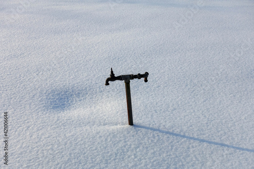 Water tap in the snow - Nordic ice worlds