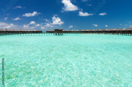 Beautiful tropical Maldives island with beach. Sea with water bungalows © Pakhnyushchyy