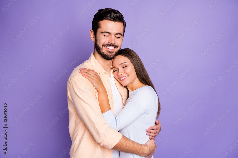 Photo of happy man and woman embrace good mood closed eyes nice smile isolated on violet color background Photo of happy man and woman embrace good mood closed eyes nice smile isolated on violet color background