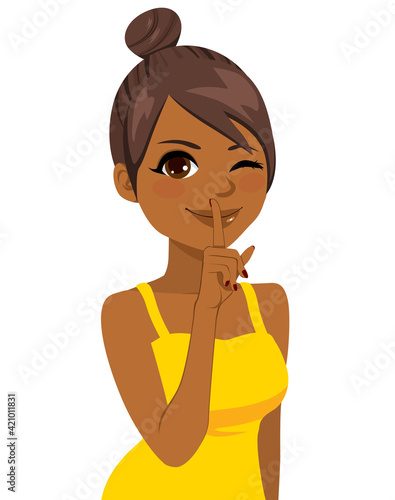 Beautiful black girl with finger on lips making silence hand sign gesture