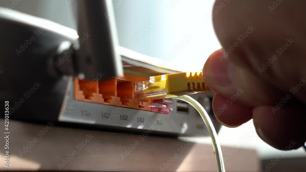 Connecting the Internet Cable from the Router Stock Video | Adobe Stock
