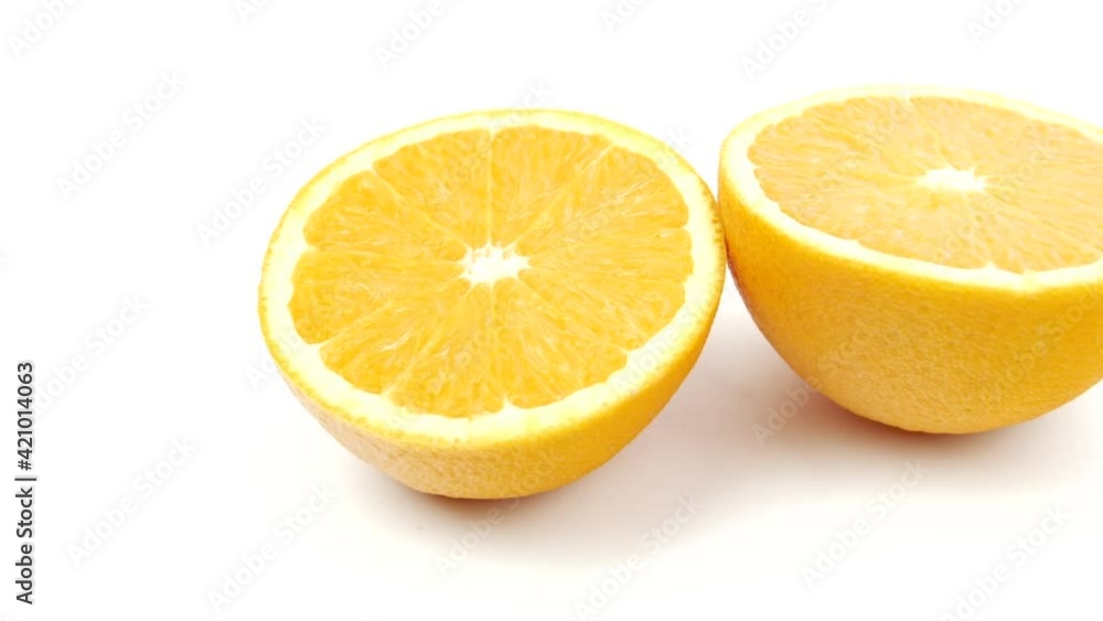 Close up of two orange isolated on white background. Concept of fruits, healthy food. footage for healthy life. rotating orange slices. Close up of two orange isolated on white background. Concept of fruits, healthy food. footage for healthy life. rotating orange slices.
