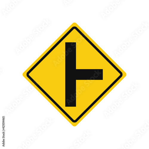 Rhomboid traffic signal in yellow and black, isolated on white background. Warning of side road on the right  at a perpendicular angle