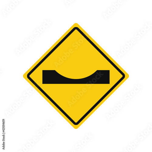 Rhomboid traffic signal in yellow and black, isolated on white background. Warning of dangerous dip